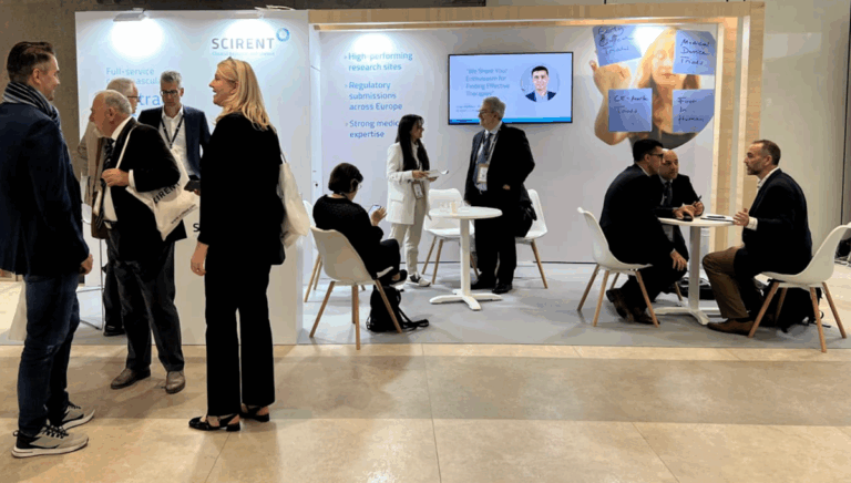 SCIRENT booth at ESC Heart Failure 2025 in Belgrade with people networking, seated discussions, and clinical research banners in the background.